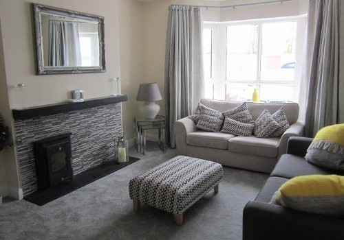 Photograph of Jacobs Island house sitting room with grey and yellow decor